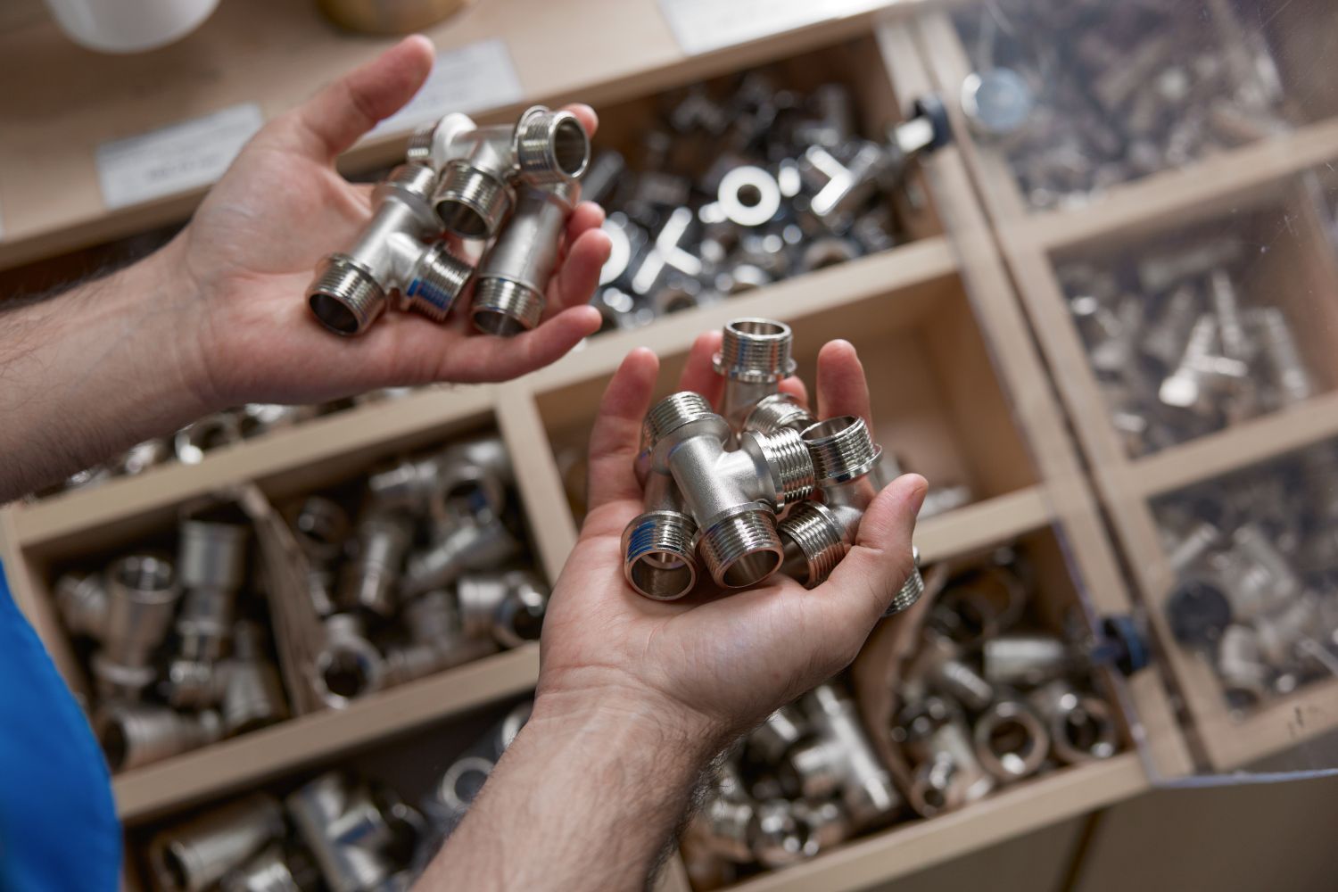 plumber holding air fittings